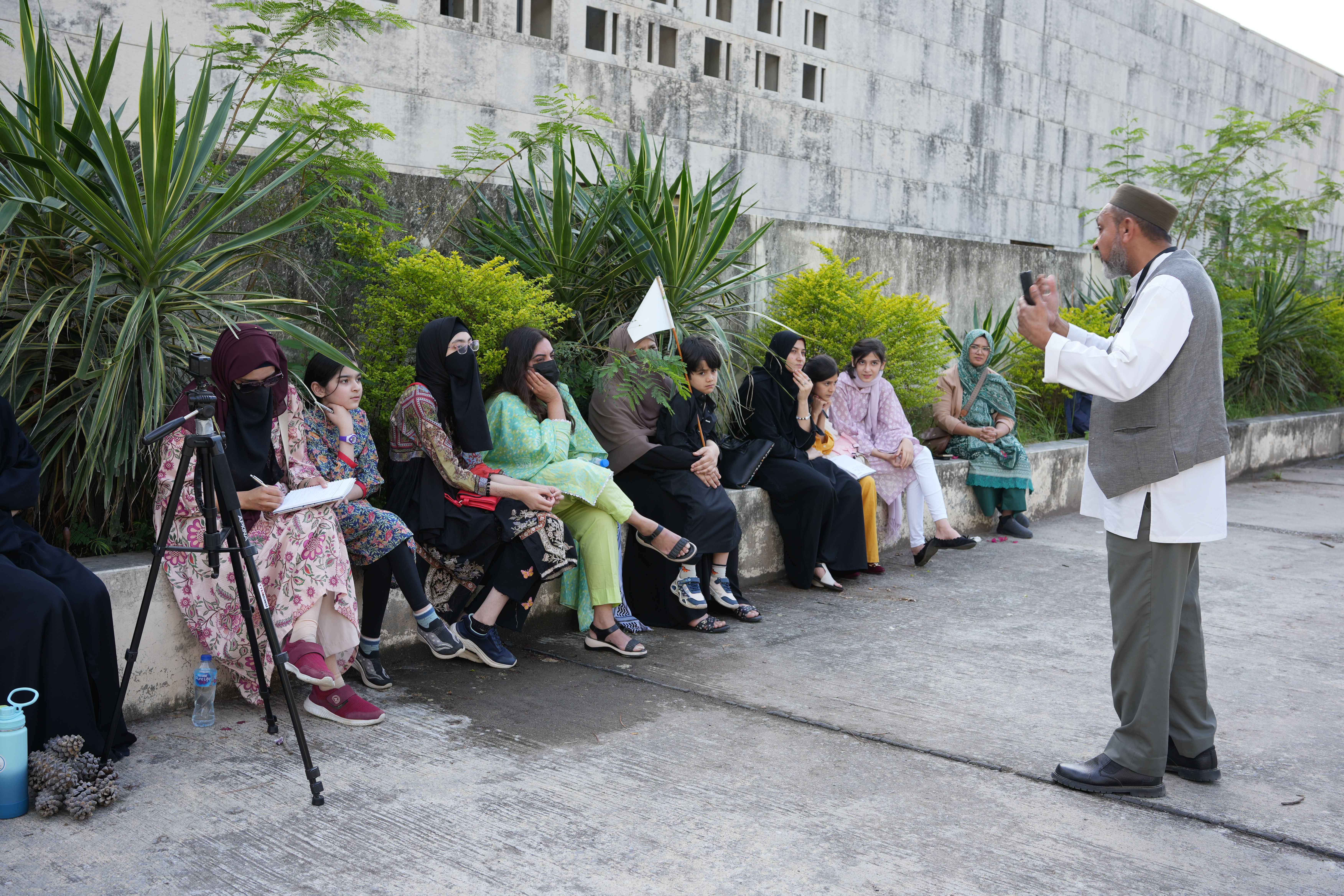 Founding Leaders — Tour guide sharing captivating stories of Pakistan's founding leaders with the audience.
